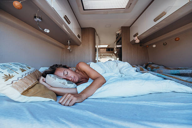 istock Woman Sleeping Comfortably Inside Camper Van 2237928408