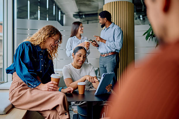 istock Diverse coworkers on office break relaxing and laughing 2237933188