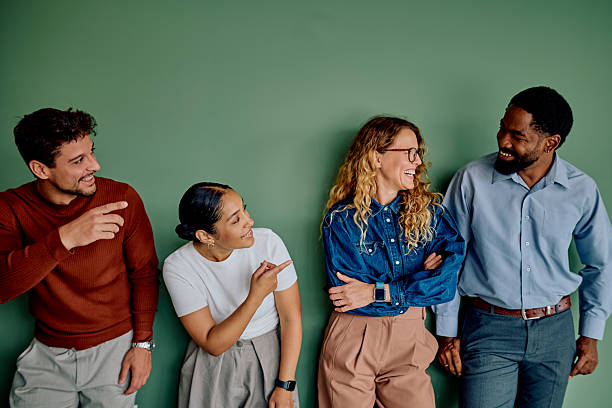 istock Diverse coworkers pointing laughing having fun in office 2237933435