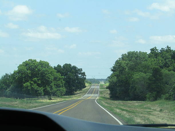 istock Long never-ending road on a car trip 2237938749