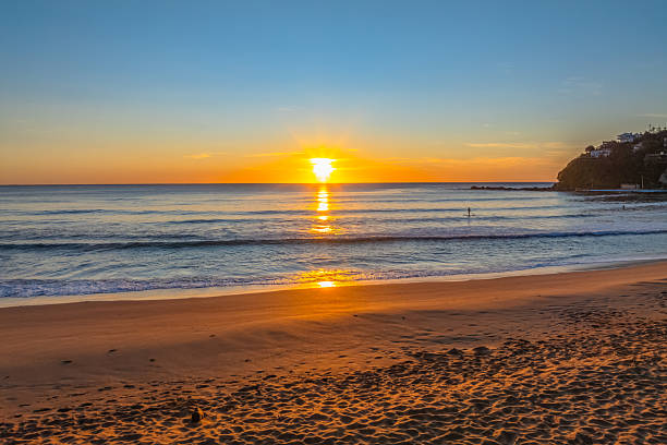 istock Ocean Sunrise Under Clear Skies with Orange Horizon 2237946873