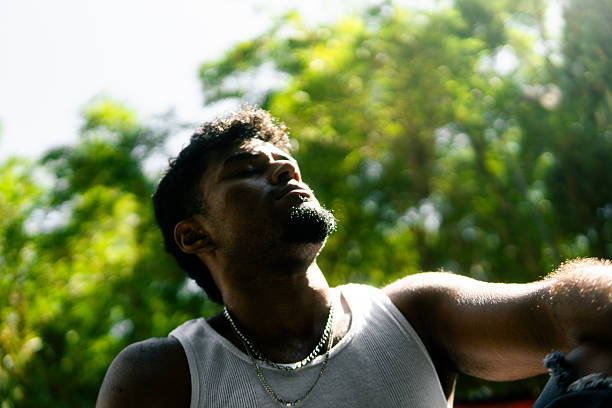 istock Young hispanic man enjoying sunlight in nature 2237946940