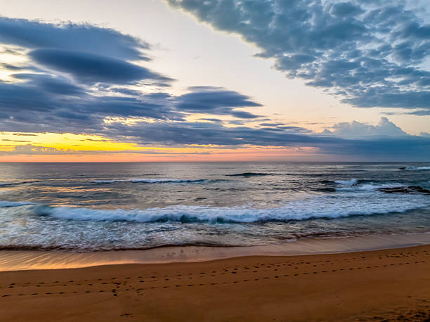 istock Seaside Sunrise Under a Cloud-Filled Sky 2237946978