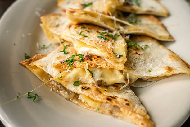 Delicious Cheese Quesadillas with Fresh Herbs and Crispy Edges