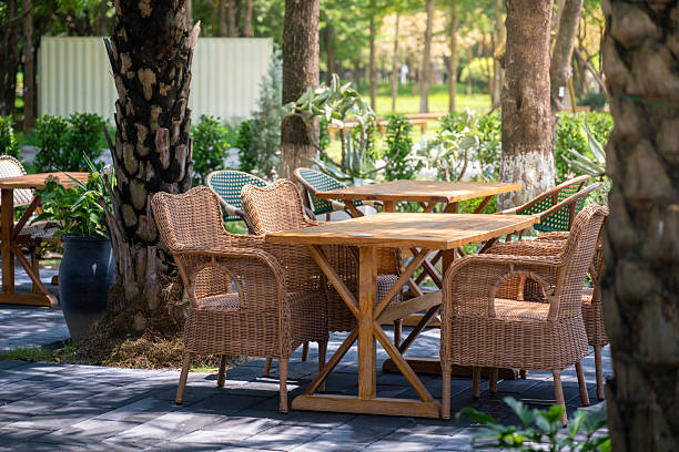 istock Cozy Dining Tables and Chairs in a Serene Park Setting 2237953748