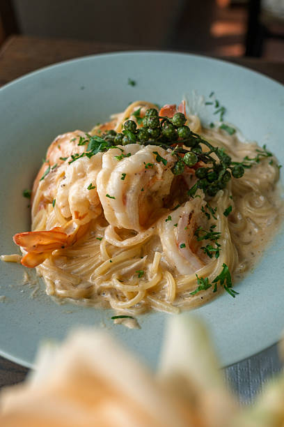 istock Creamy Shrimp Alfredo Pasta with Fresh Herbs and Peas 2237953754