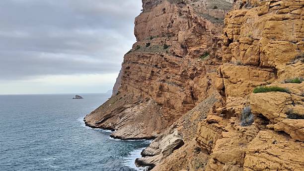 istock Beautiful Scenic Coastal Cliffs That Majestically Overlook the Serene Ocean Waves Below 2237953930