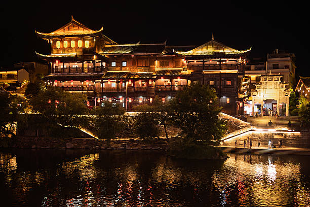 istock Ancient Town Water Village Under the Night Sky: Illuminated Traditional Architecture Reflecting on Calm Waters 2237954581