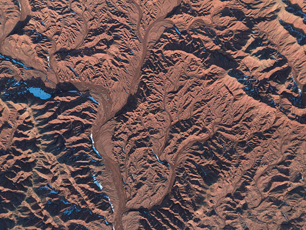 Magnificent Red Mountain Landscape with Intricate Ridge Patterns and Sparse Vegetation