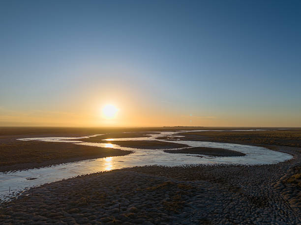 istock A Serene Sunset Over a Winding River in a Vast Landscape 2237955080