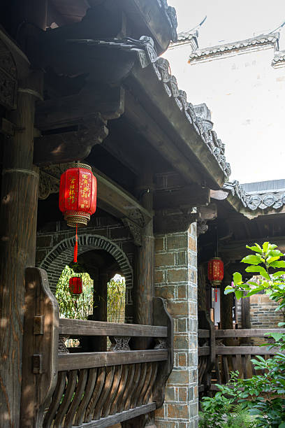 istock A Traditional Chinese Courtyard Gateway with Elegant Wooden Architecture and Red Lanterns 2237957227