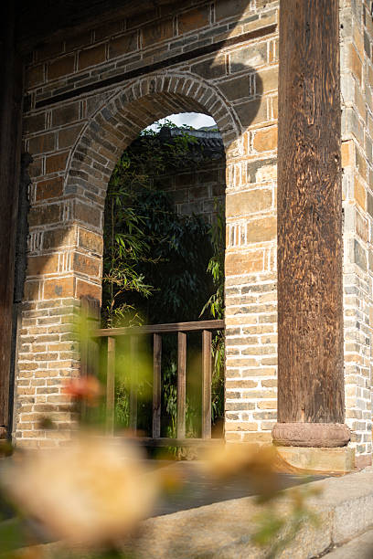 istock A Rustic Brick Archway Framing Bamboo Shadows in a Traditional Courtyard 2237957281