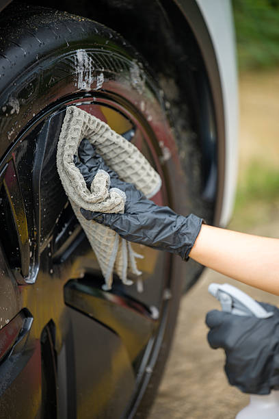 istock Car Cleaning: Carefully Wiping the Headlight with a Microfiber Cloth 2237957681
