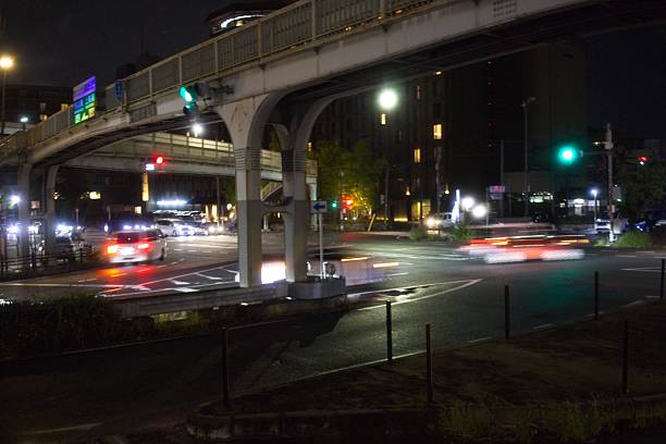 istock Nighttime urban traffic scene with light trails 2237958025