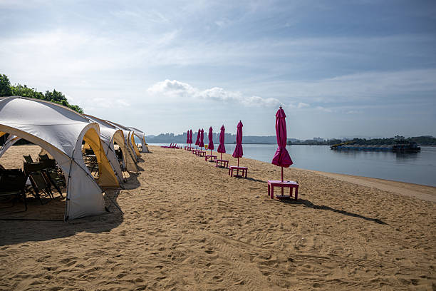 istock Relaxing Tents and Umbrellas on the Sandy Beach 2237964449