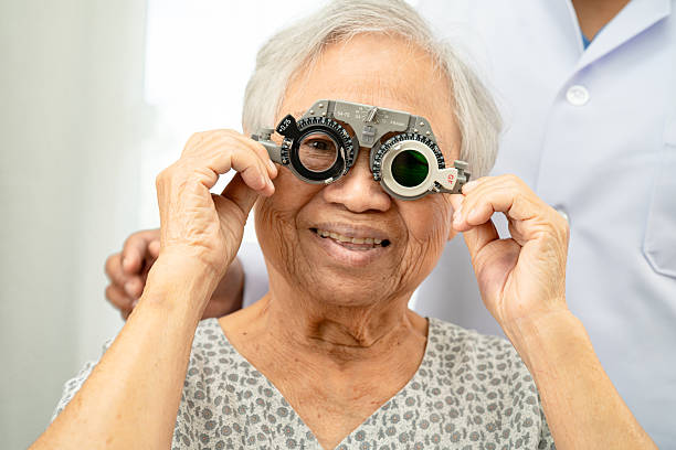 istock Asian senior woman wearing ophthalmic vision eye test and using optical trial frame. 2237964497