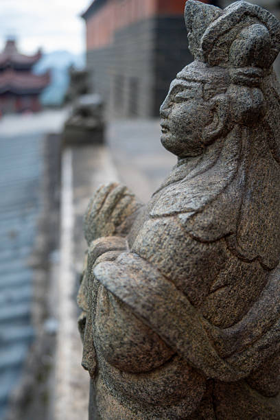 istock Ancient Stone Sculpture of a Warrior Guarding a Temple 2237966717