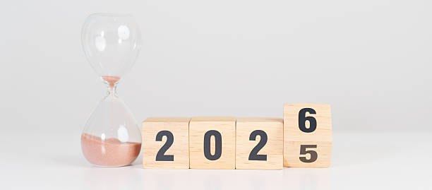 istock 2025 end year to Happy New Year 2026 with hourglass on table. Resolution, time, plan, goal, motivation, reboot, countdown and New Year holiday concepts 2237969365