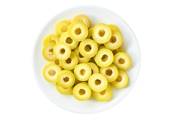 istock Cut green olive rings in a plate isolated on a white background, top view. 2237970308