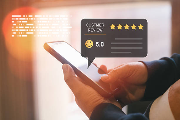istock Customer using smartphone with online review and rating stars interface overlay, customer satisfaction representing feedback, online reputation, business quality, and digital user experience. 2237970353