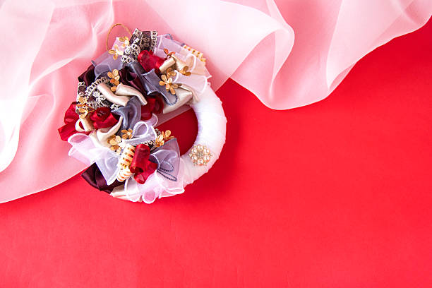 Gorgeous and chic ribbon wreath with red and white background. / Red type wreath/