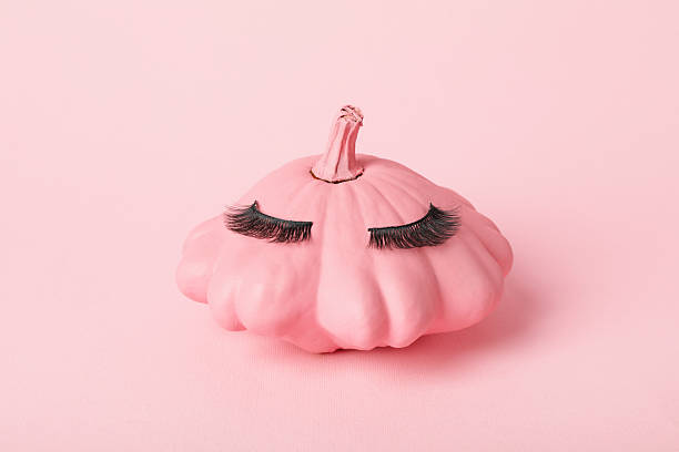 istock Pumpkin with eyelashes. Skin and face care concept. 2237974347
