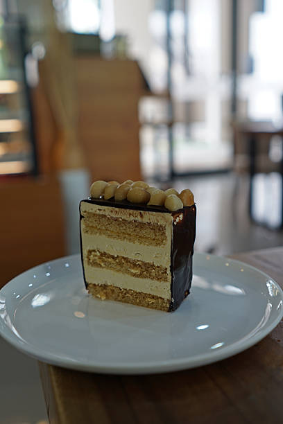 Close up Chocolate and butter layer caked topped with Macadamia nut