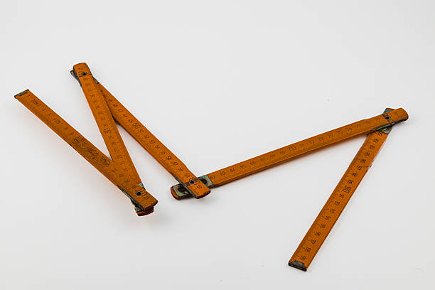 istock Vintage wooden folding ruler with measurement markings on a white background 2237975375
