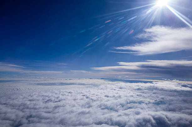 Sky and horizon, above the atmosphere above the clouds, the flare of the sun.