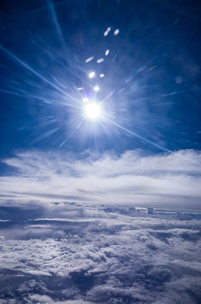 Sky and horizon, above the atmosphere above the clouds, the flare of the sun.