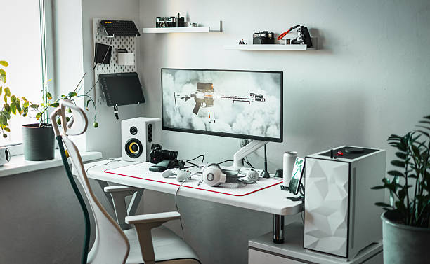 istock Well-organized gaming space with essential peripherals: gaming keypad, ergonomic mouse, and ultra-wide monitor. Gamer maintains productivity and comfort in a clean and efficient workspace. 2237980190