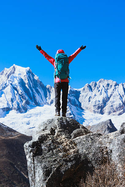 istock Successful backpacking woman hiking on high altitude mountain top 2237981274