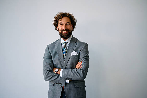 istock Professional businessman with beard standing in corporate office 2237981413