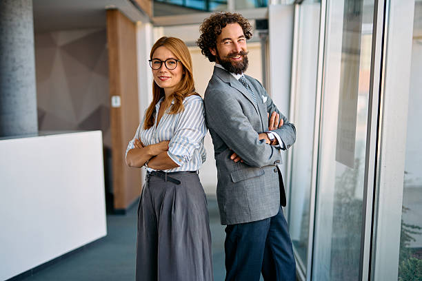 istock Business colleagues standing back to back in office 2237981485