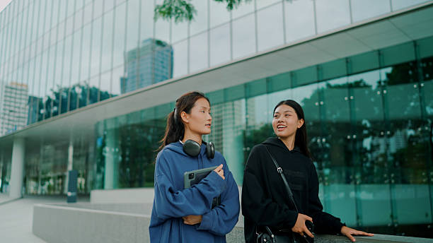 istock Young Asian women talking casually while walking to class together. 2237982533