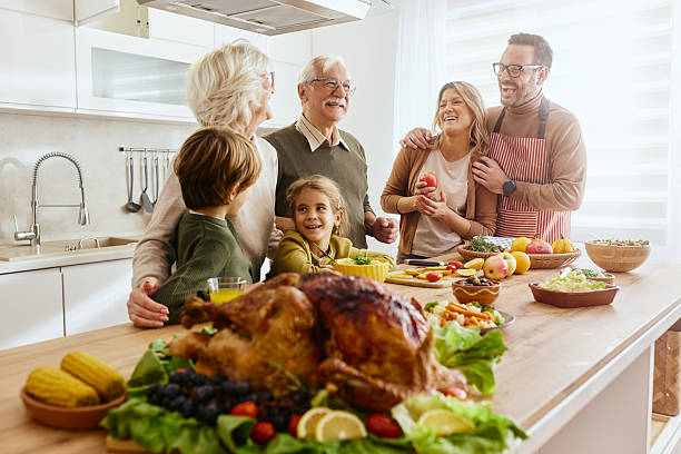 istock Happy extended family talking on Thanksgiving at kitchen counter. 2237983834