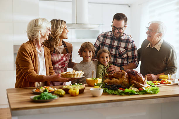 istock Happy multi-generation family enjoying during Thanksgiving in the kitchen. 2237984107