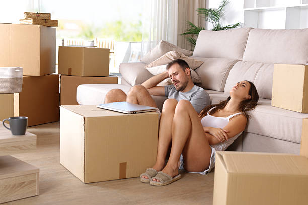 istock Sad and tired couple moving home 2237986778