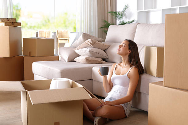 istock Woman relaxing drinking coffee while moving home 2237986833
