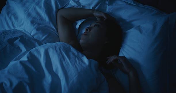 istock Young Tired Woman With Anxious Thoughts Cannot Sleep at Night 2237986946