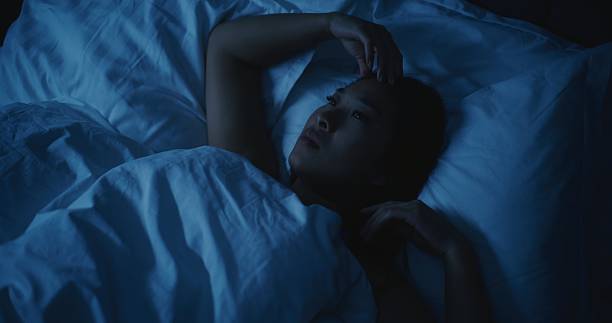 istock Young Tired Woman With Anxious Thoughts Cannot Sleep at Night 2237986995