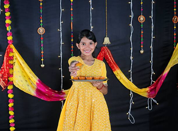 a 10 year old Indonesian girl wearing traditional clothes from Palembang. Isolated on White Background