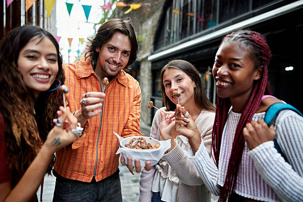 istock Group enjoying gnocchi dipped in chocolate, Camden Town 2237987556