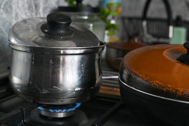 istock Preparing dinner at home, pots on the gas stove. 2237991437