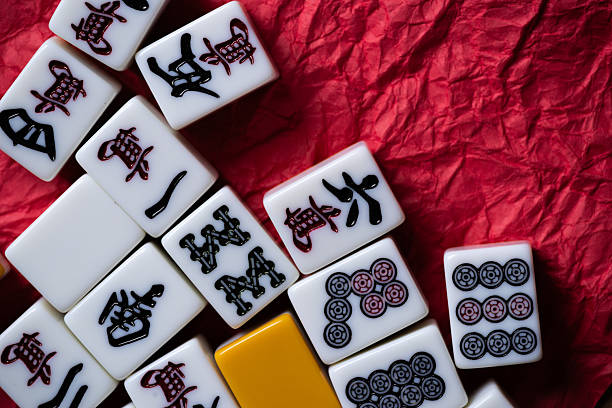 istock Mahjong tiles lined up on a red background 2237993689