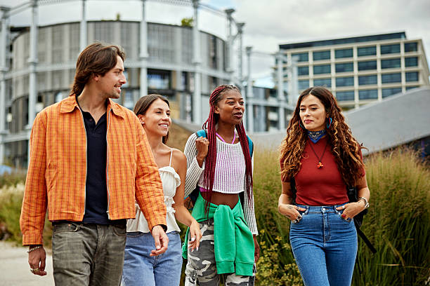 istock Young friends walking and talking outdoors 2237993966