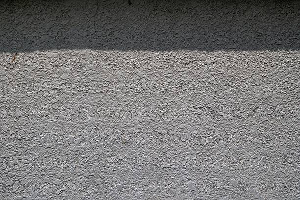 istock The pattern of surface wall concrete for background. Abstract of surface wall concrete for vintage background. Rusty damaged to surface wall. 2237994402