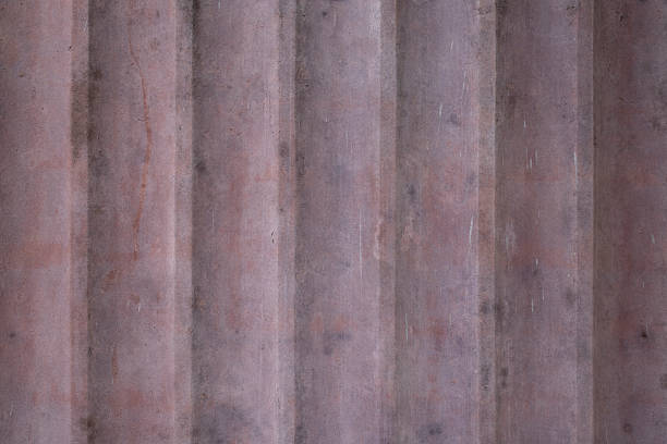Corrugated metal roller shutter texture. Vivid red steel door for background.