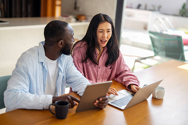 istock A happy, multi-national couple who are digital nomads and work from a different country every month 2237996577