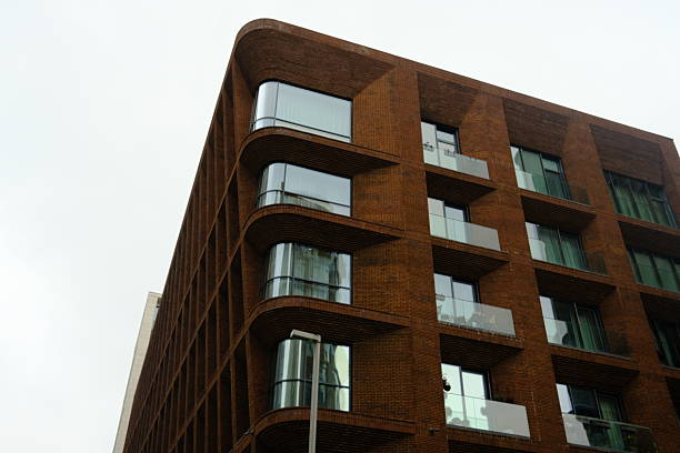 Building facade with brick wall and style windows, architecture, building exterior, window shapes, building materials